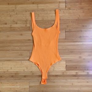 orange bodysuit